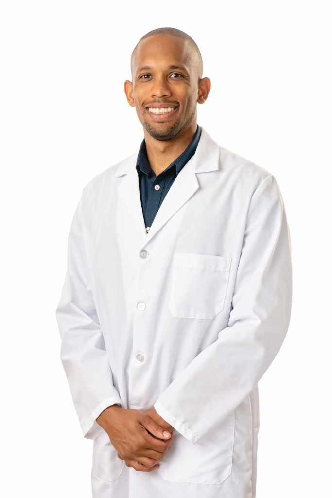 An image of Doctor Robert Knight. He is wearing a white overcoat, and has a welcoming smile.